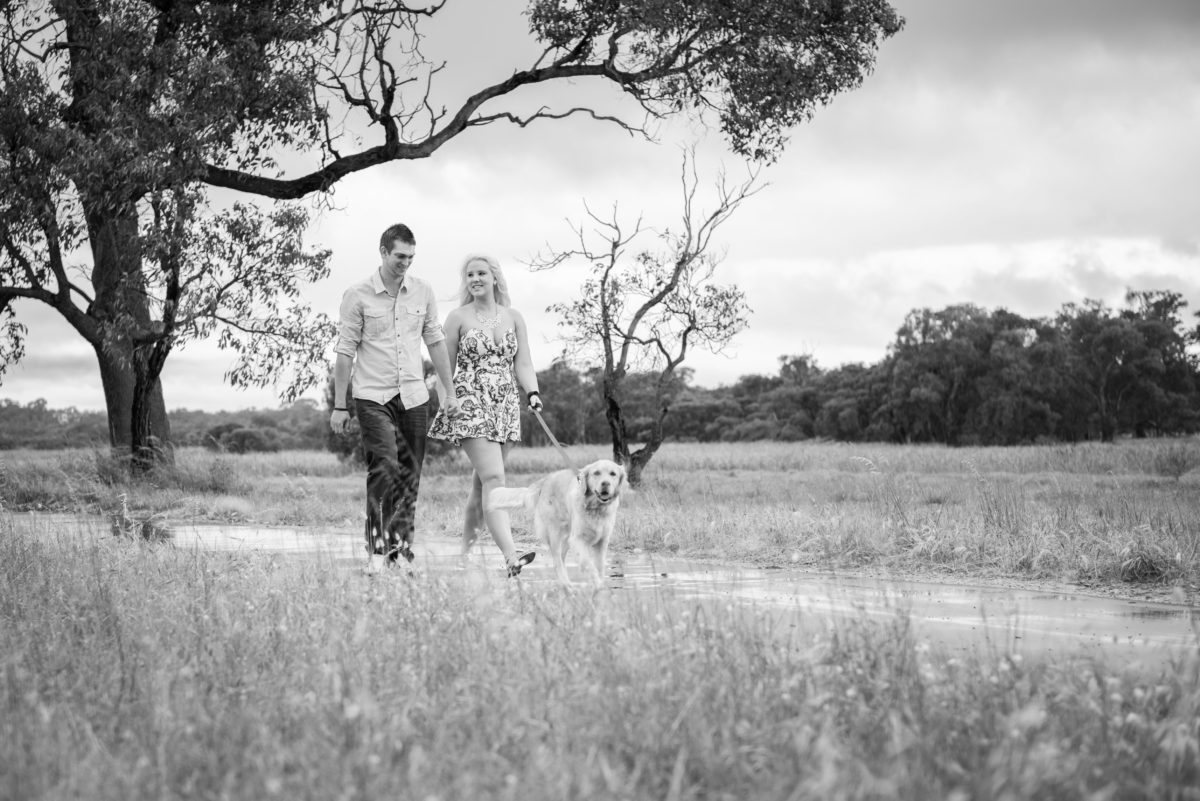 Girl and boy walking their dog, engagement shoot at Yellagonga Park