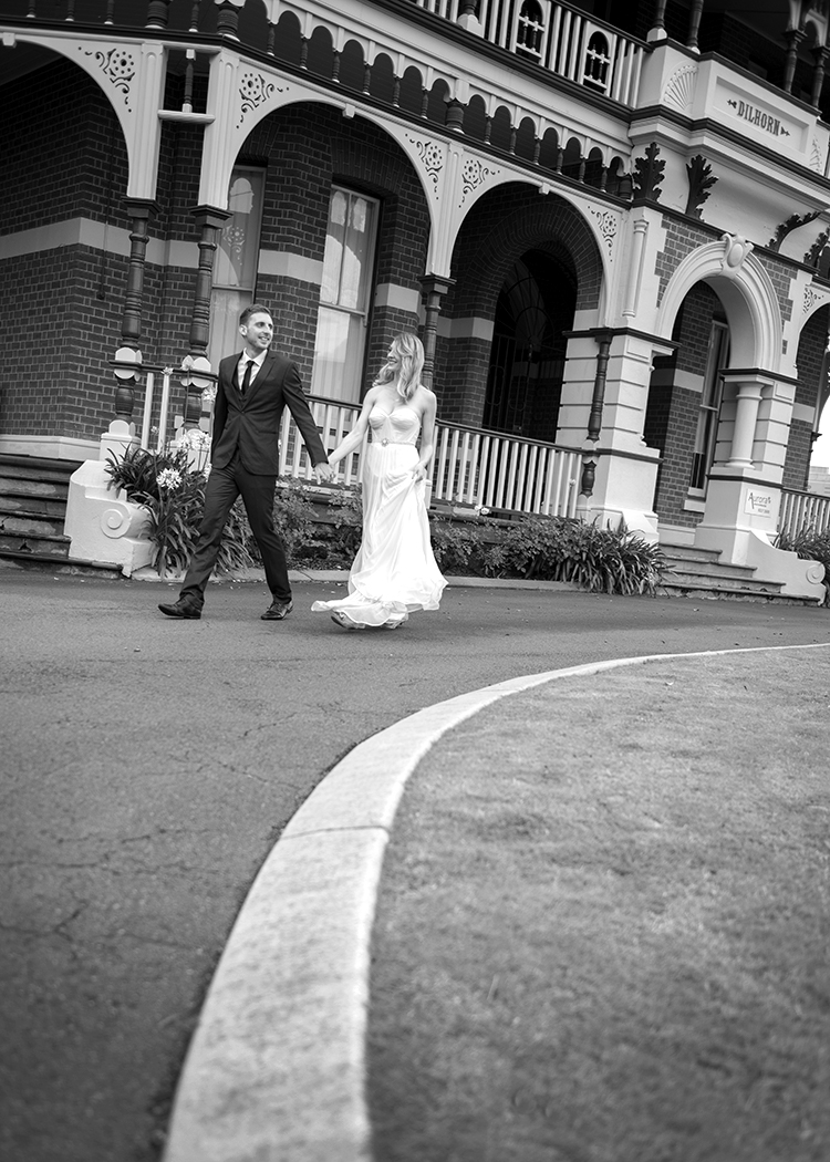 Bride and groom walking outside Dilhorn in Perth