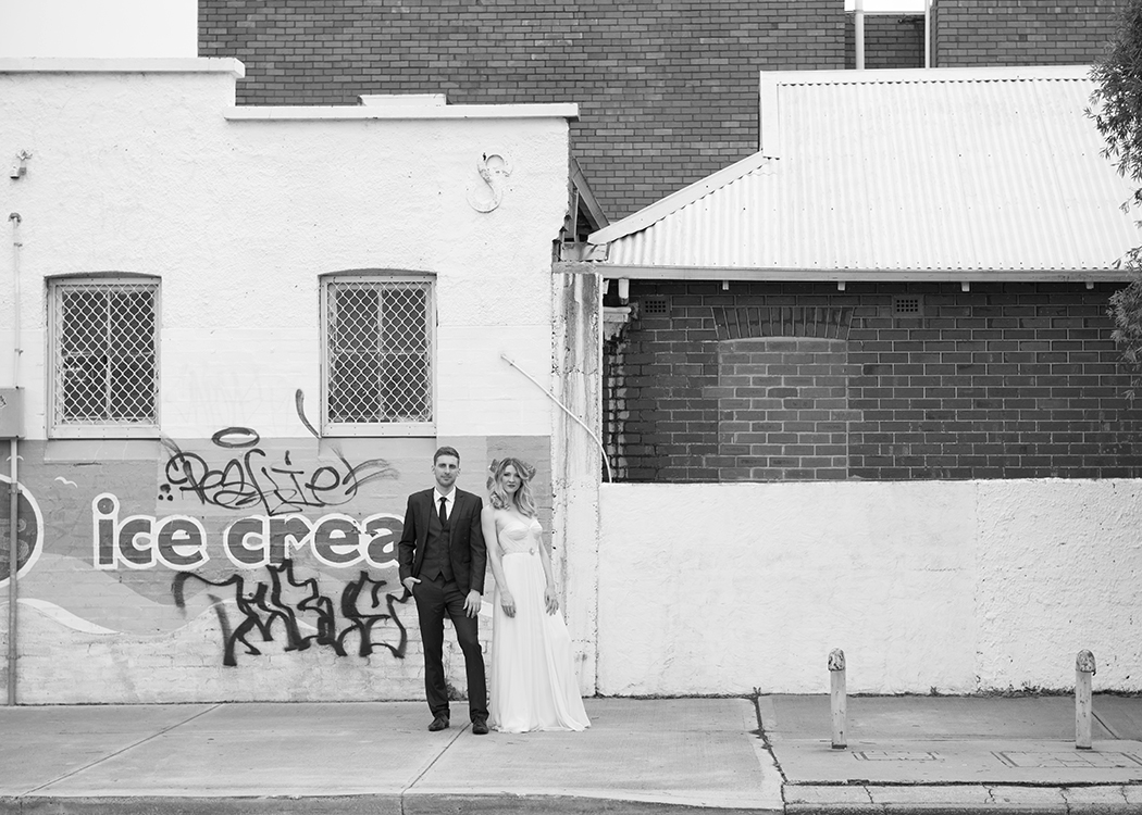 Bride and groom with graffiti