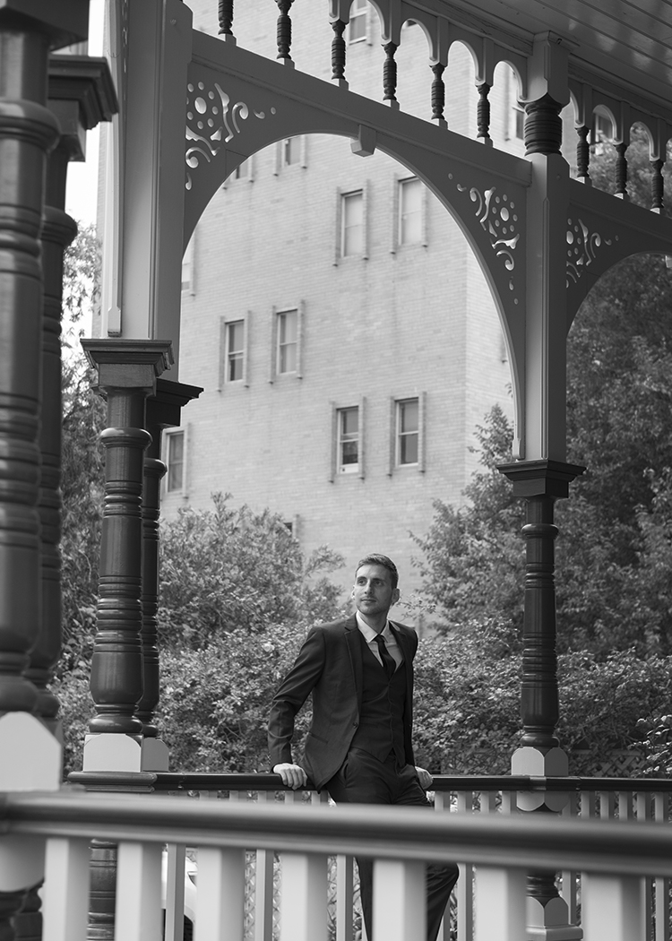 Groom standing in archway