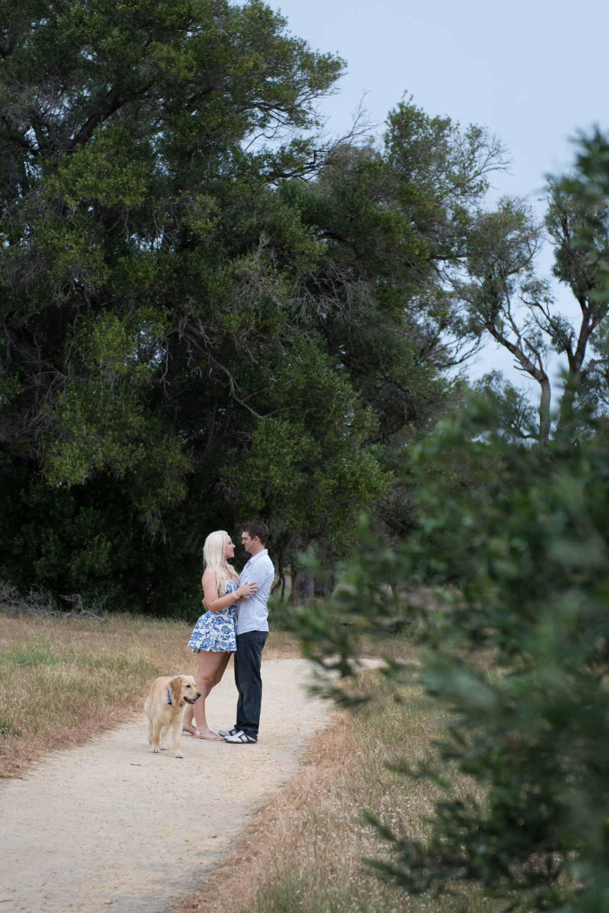 Couple hugging on a path