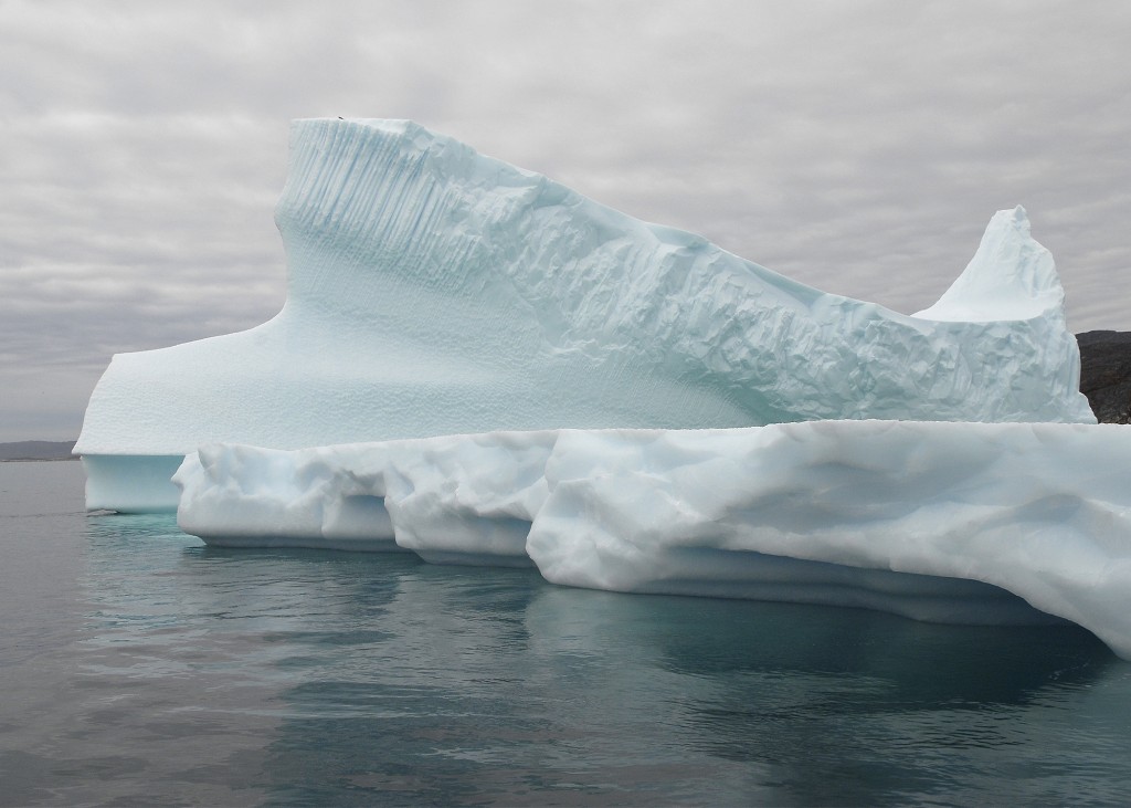 Greenland iceberg blue green colour ice