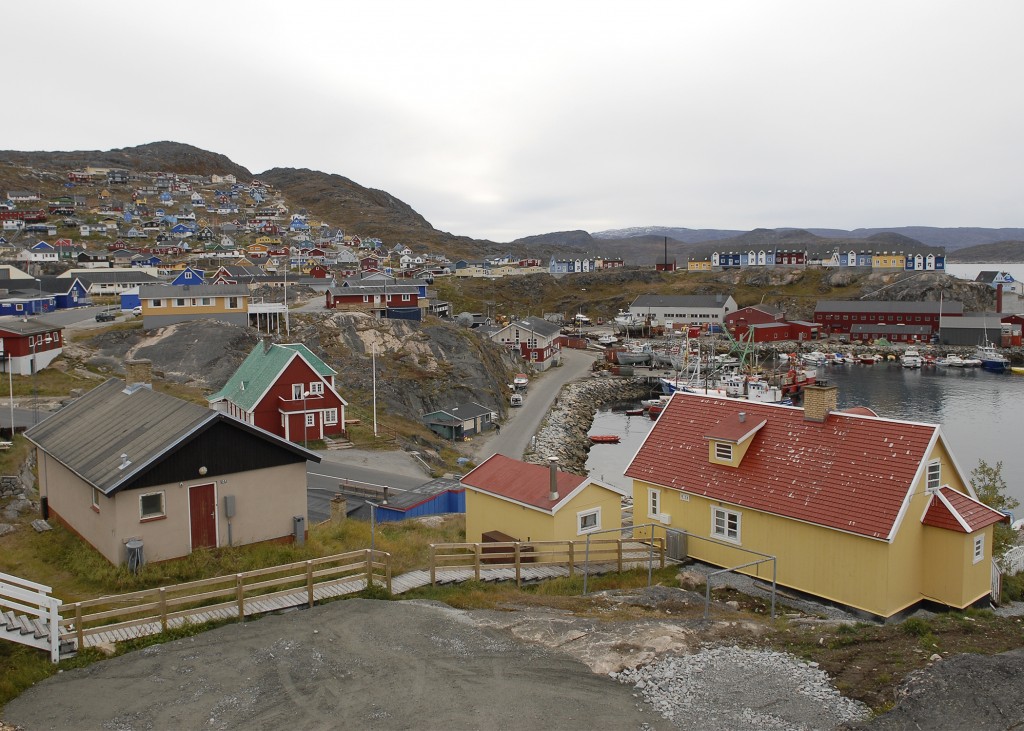 Yellow and red house with other colourful houses in Qaqortoq, Greenland