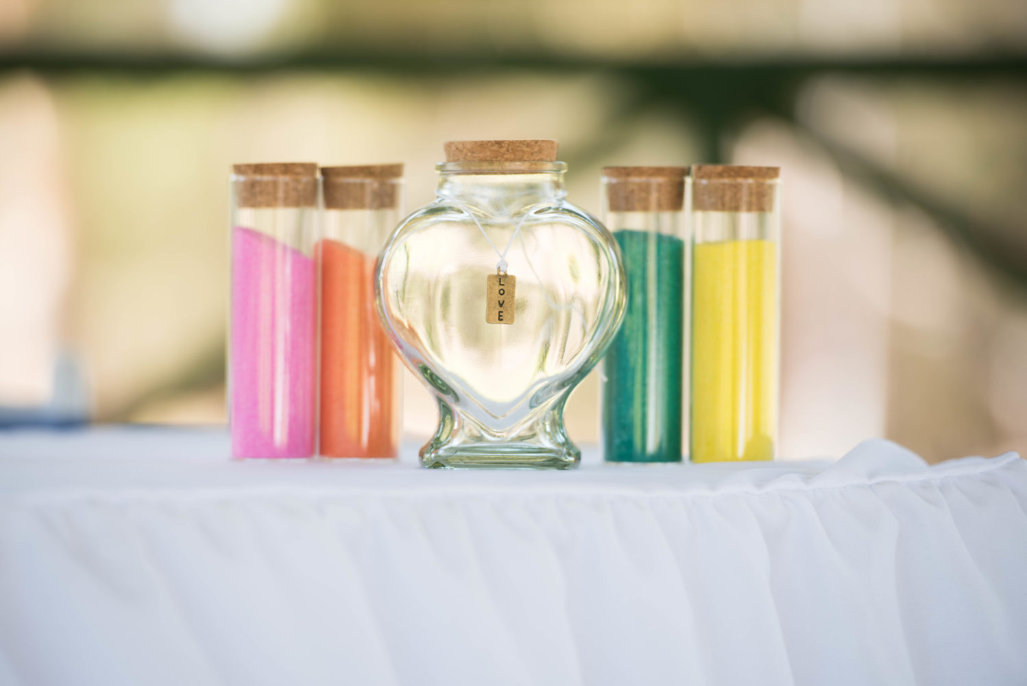 Colour photo of sand ceremony jars and coloured sand. Love.