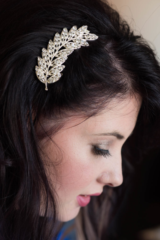 Photo of hair clip on bride's hair. Colour photo of bride's makeup. Getting ready on wedding day