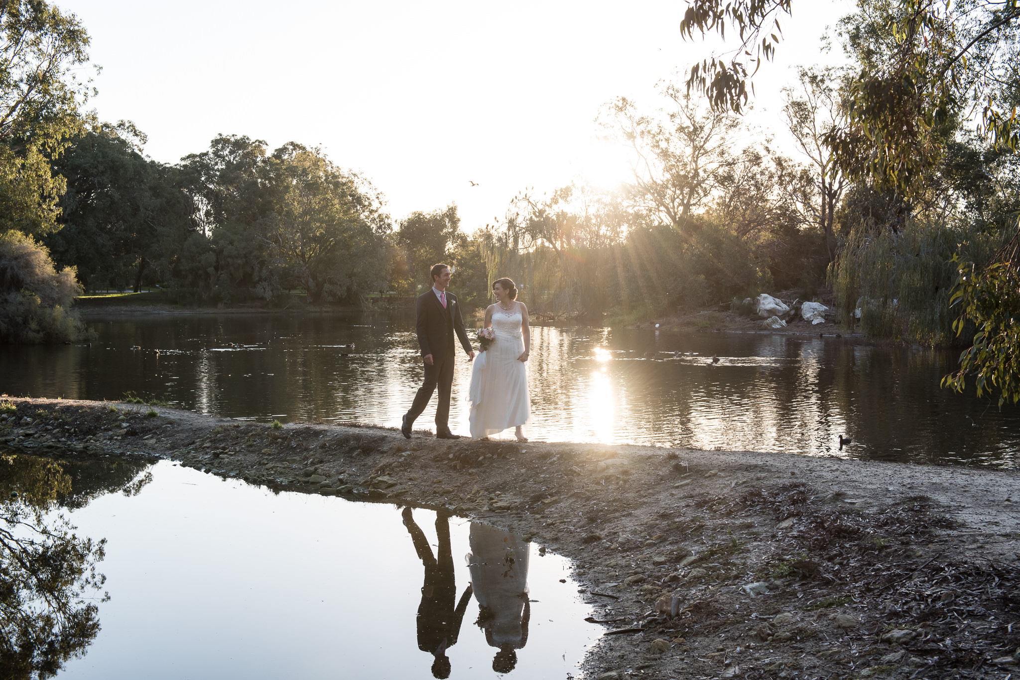 perth wedding couple near lake with reflection with photographer