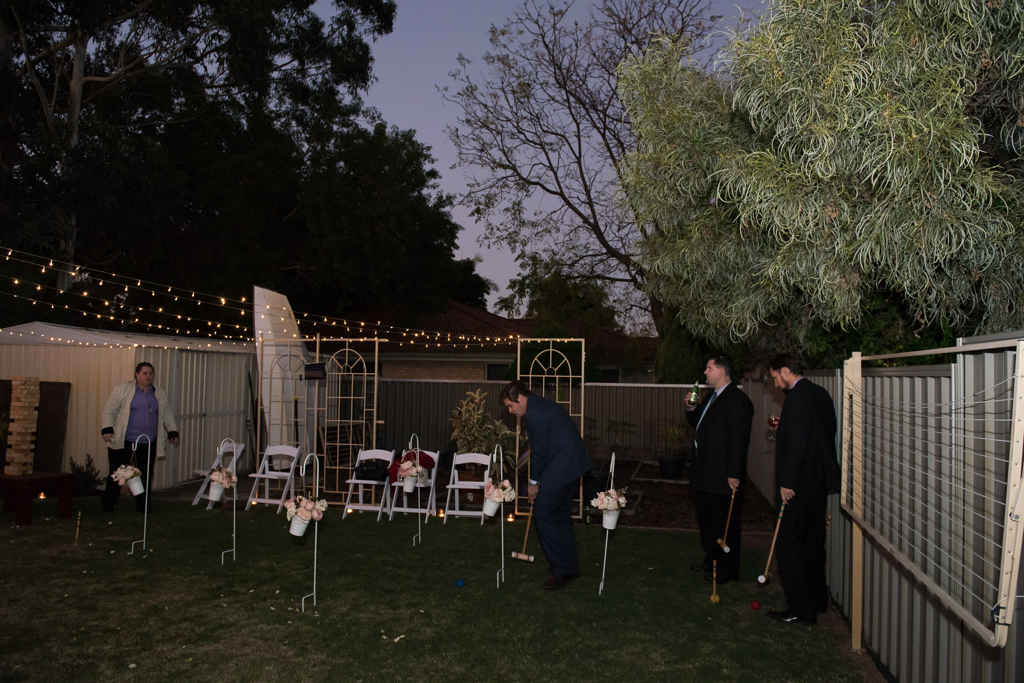 Wedding guests playing croquet