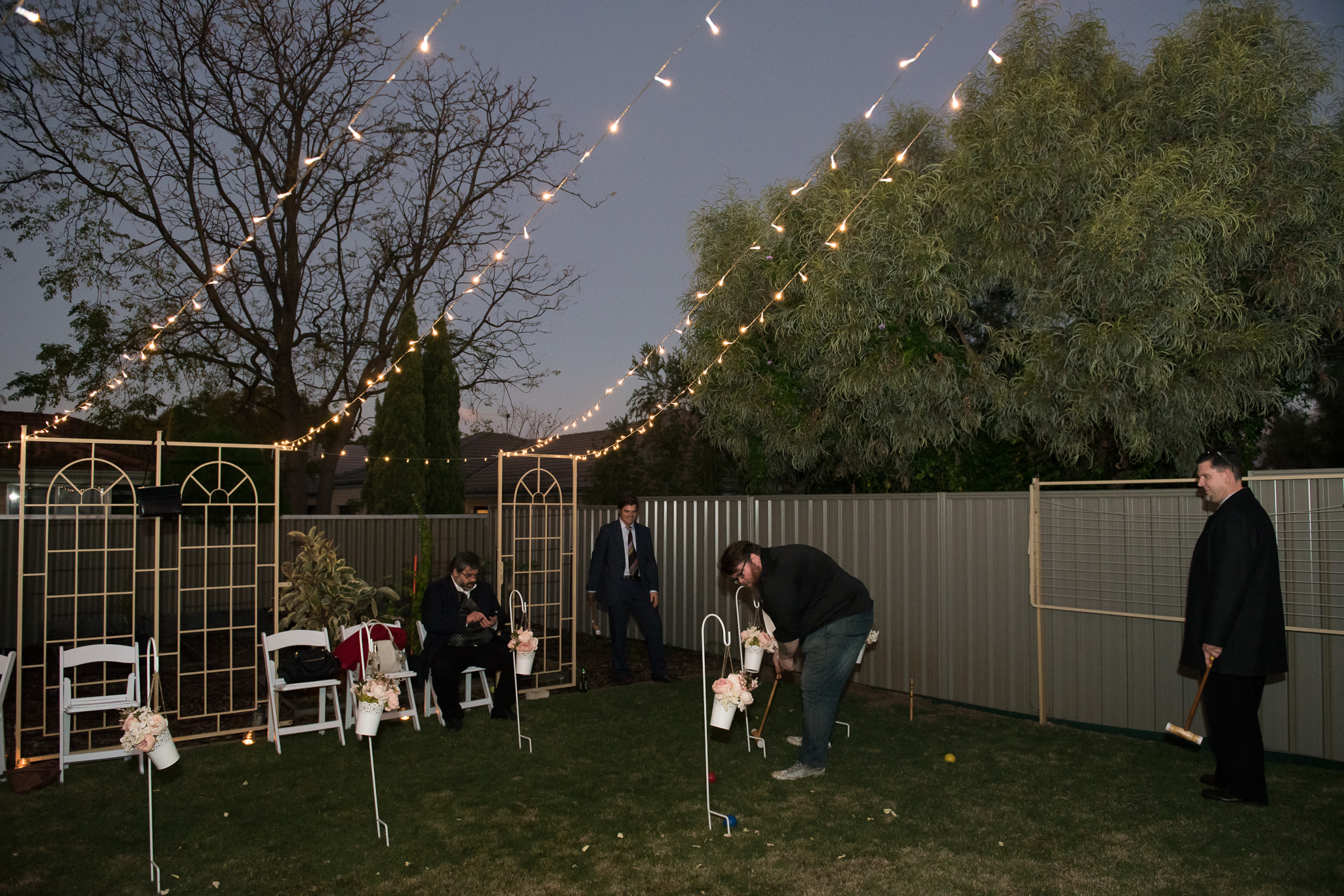 Wedding guests playing croquet