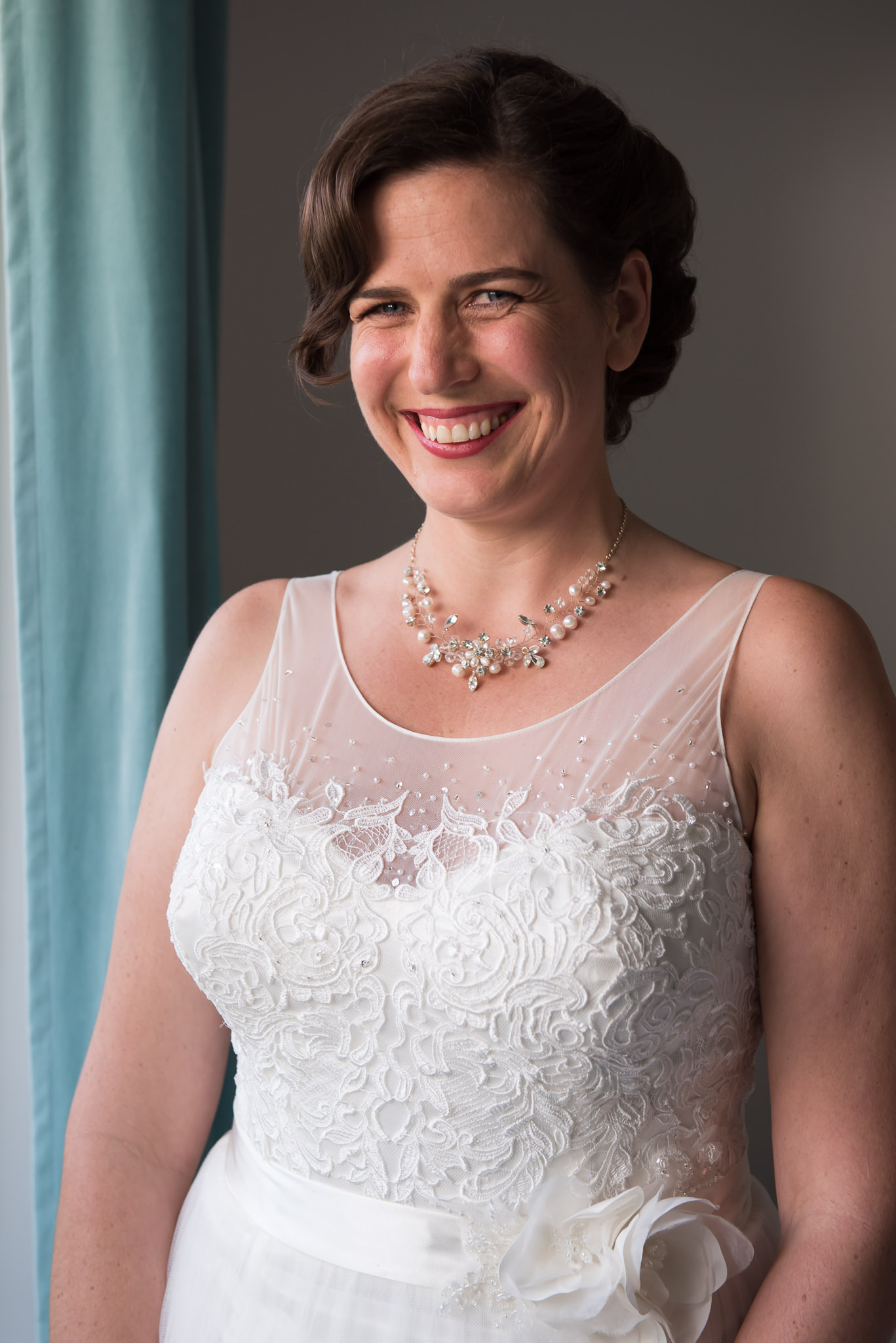 inside portrait of bride smiling