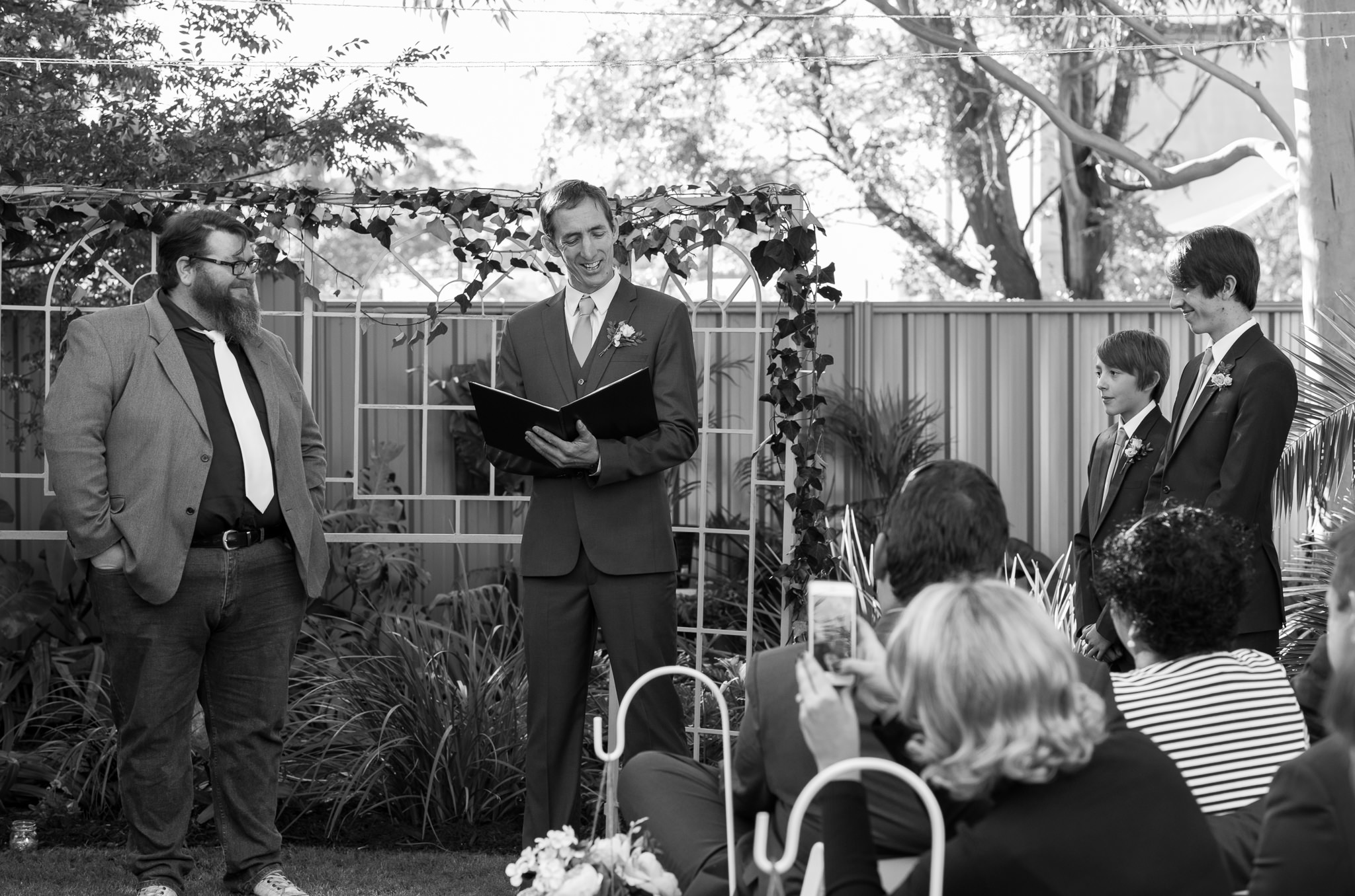 groom smile while he says his vows