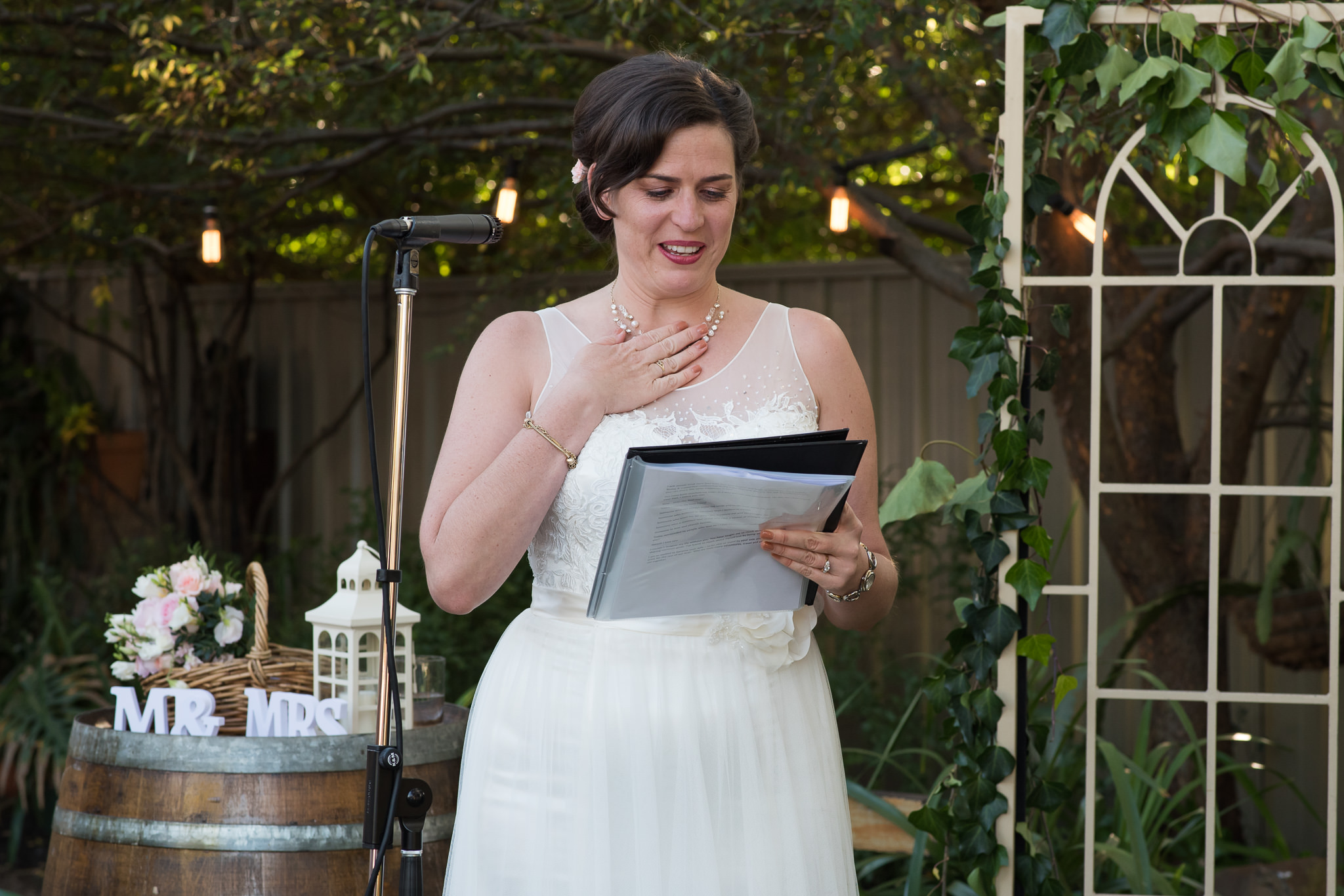 bride getting emotional during her vows