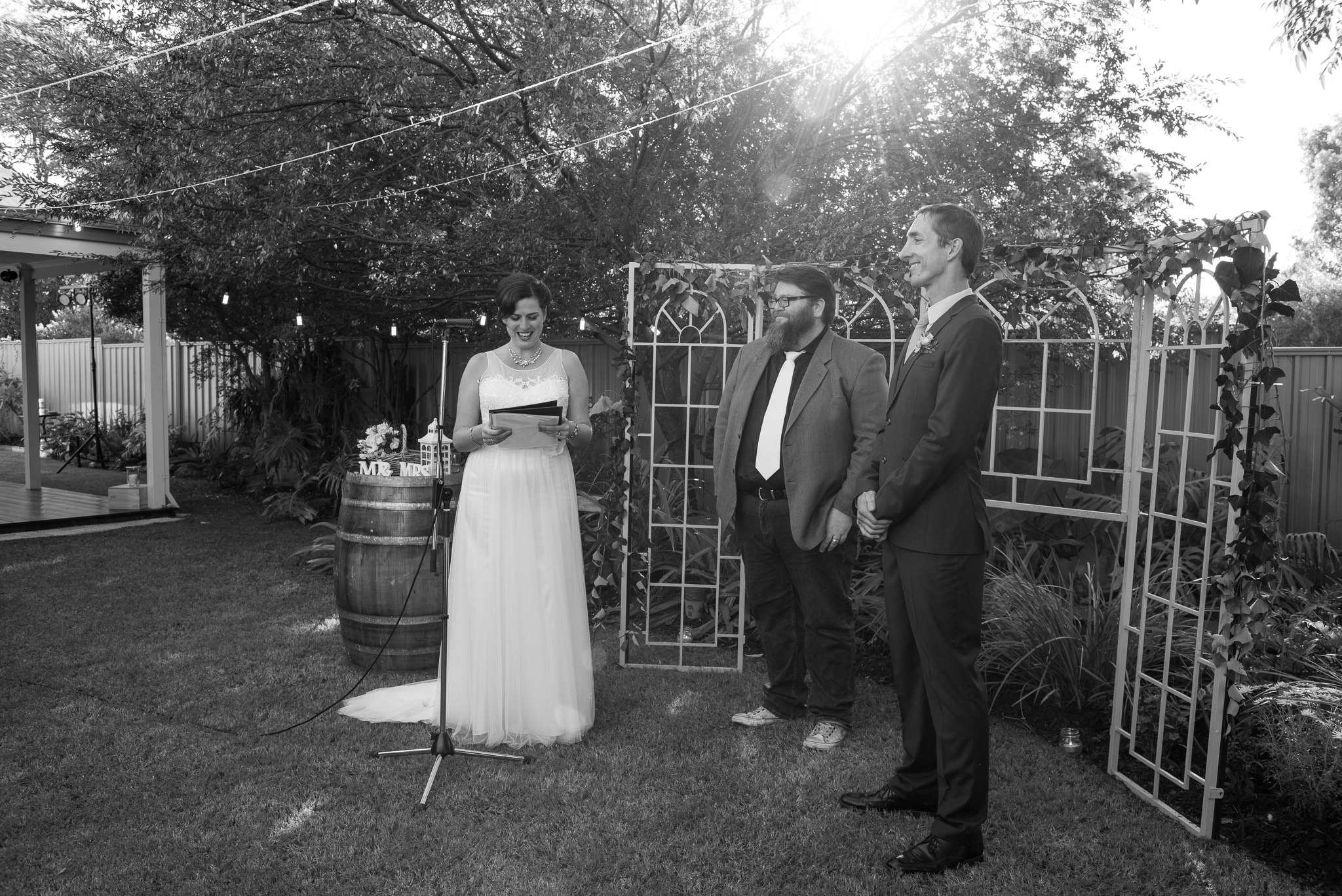 bride says her vows in backyard wedding