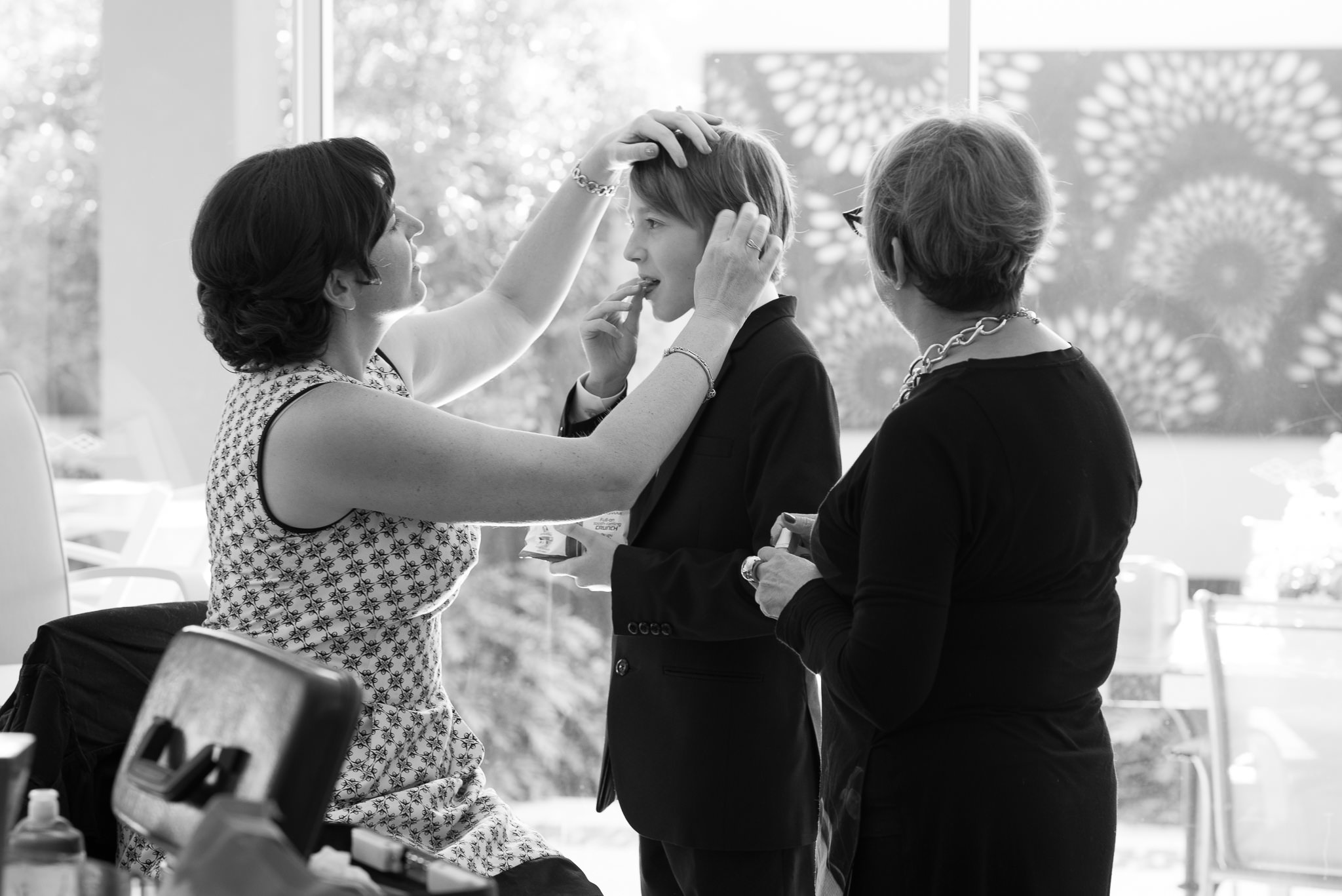 bride fixing page boy's hair