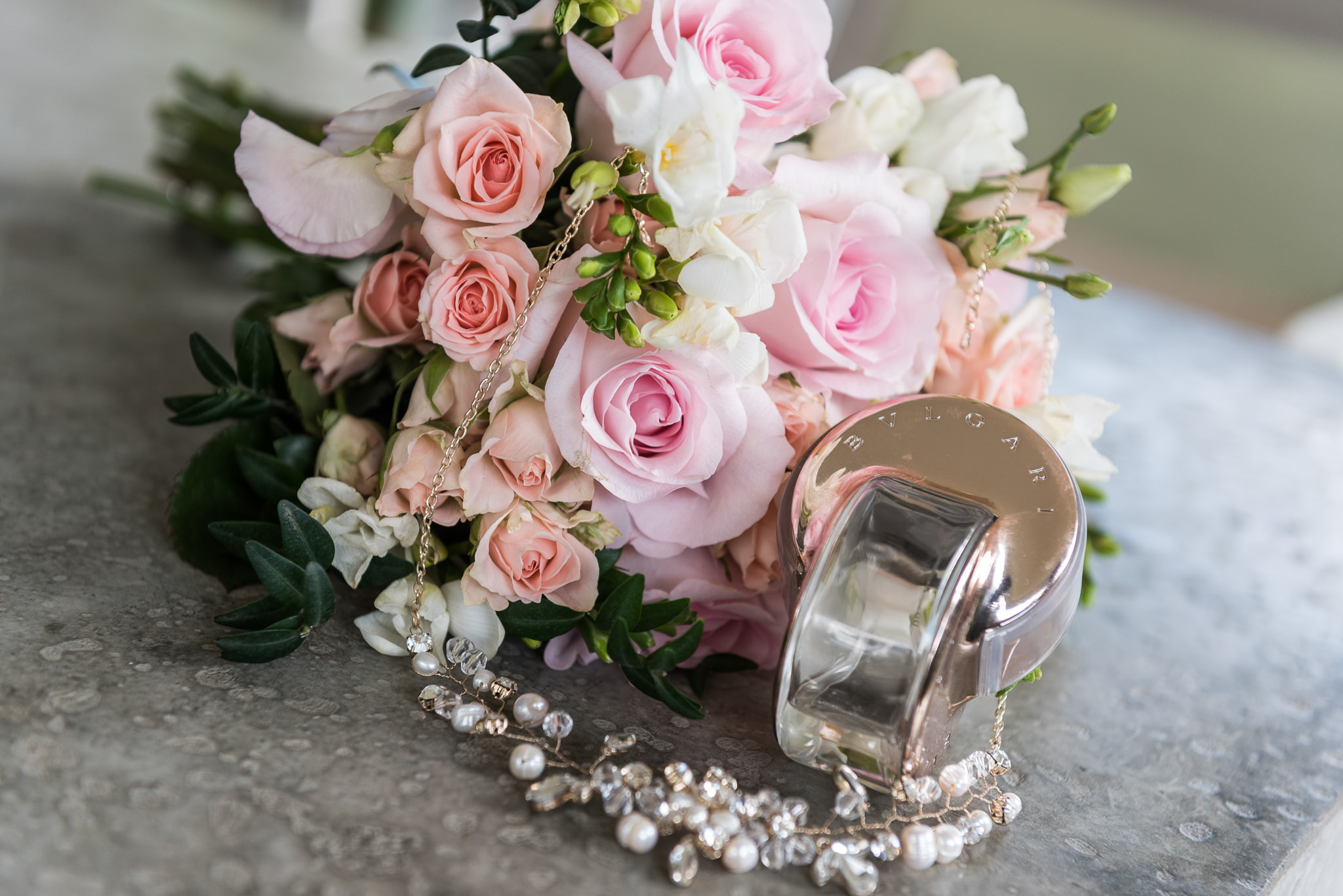 bridal arrangement of bouquet, jewellery and perfume