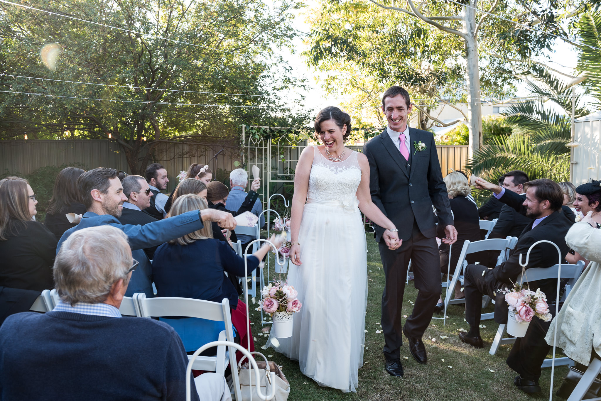 bride and groom walk back down the aisle