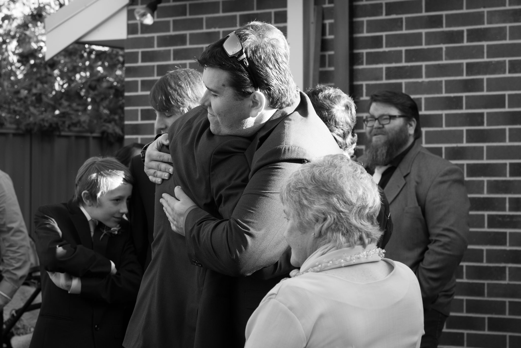 guests congratulating the groom