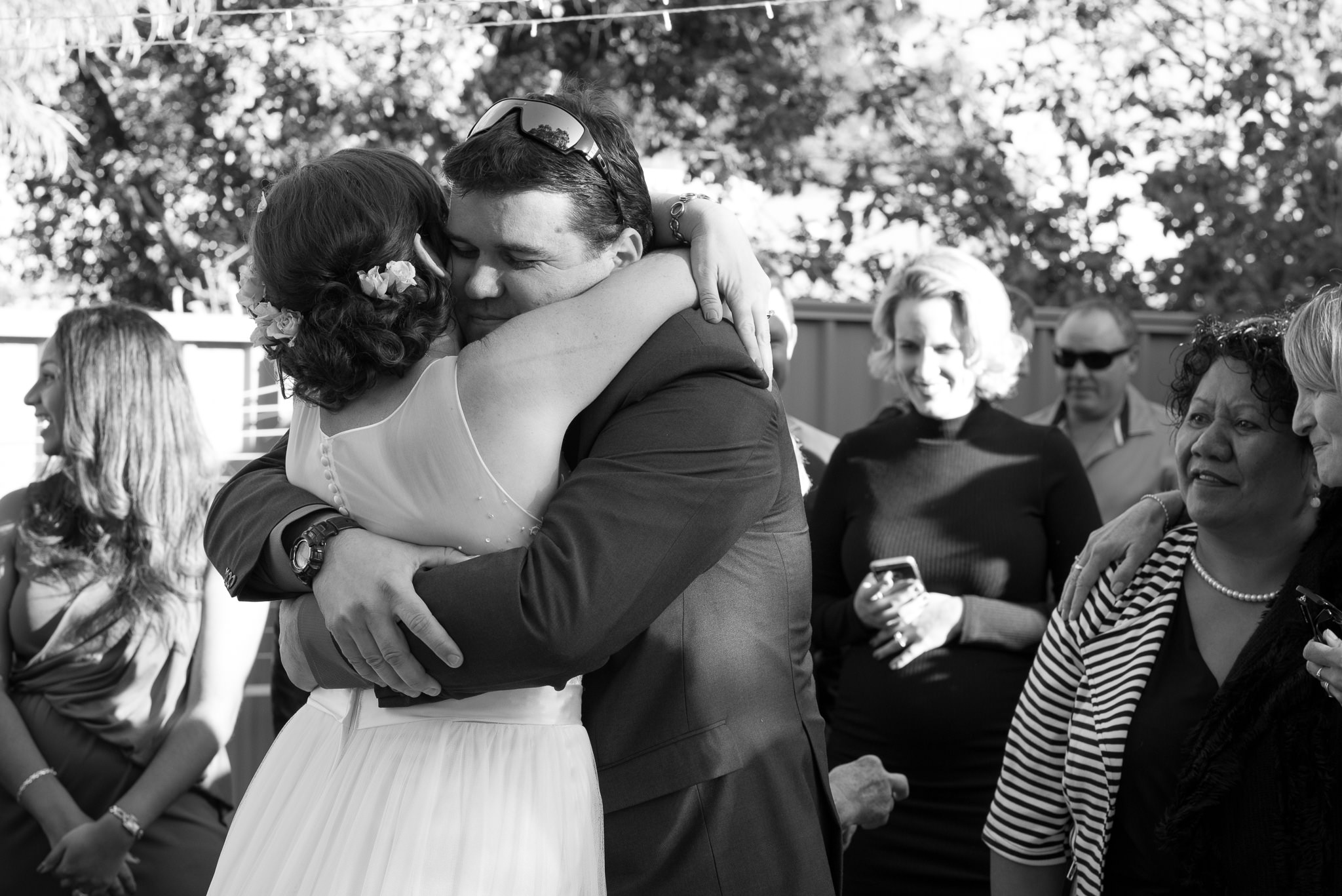 bride hugging her brother