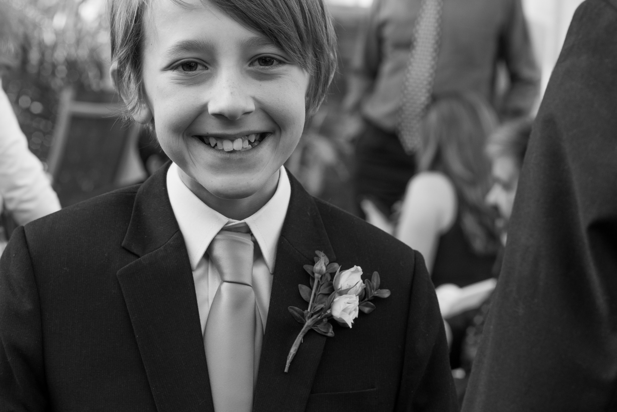 closeup of youngest son of groom smiling