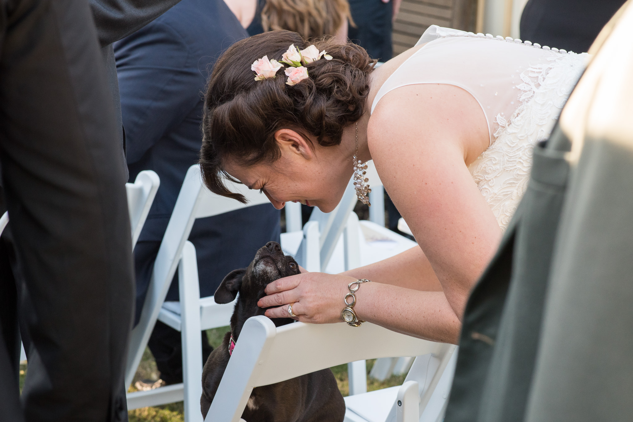 bride snuggles pet dog