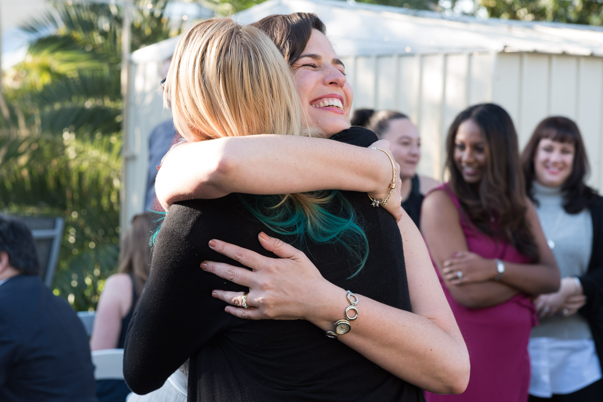 bride hugs friend