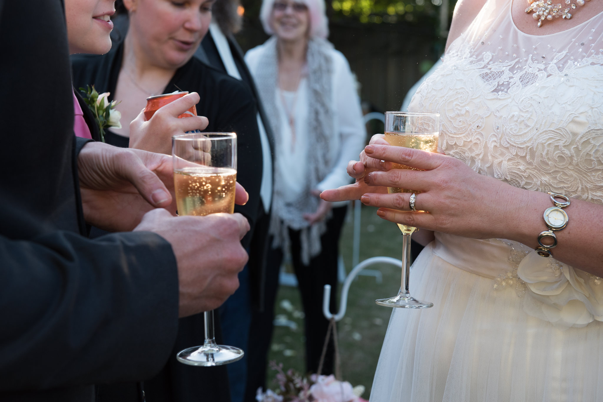 wedding guests holding champagne