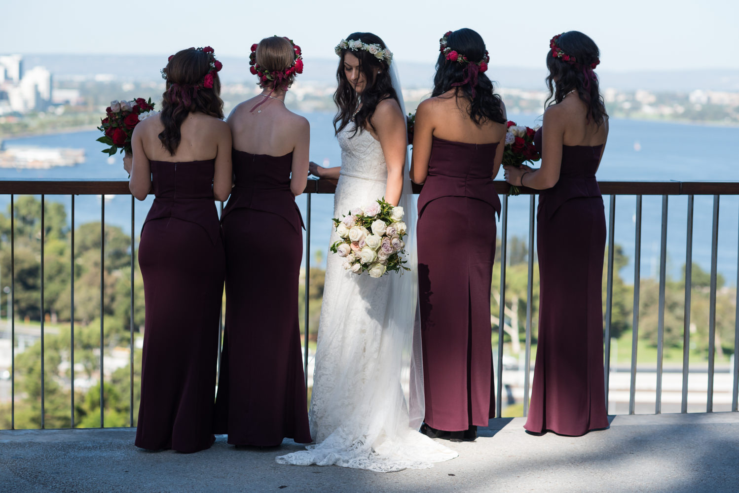 Bride looking down at bouquet in the spotlight