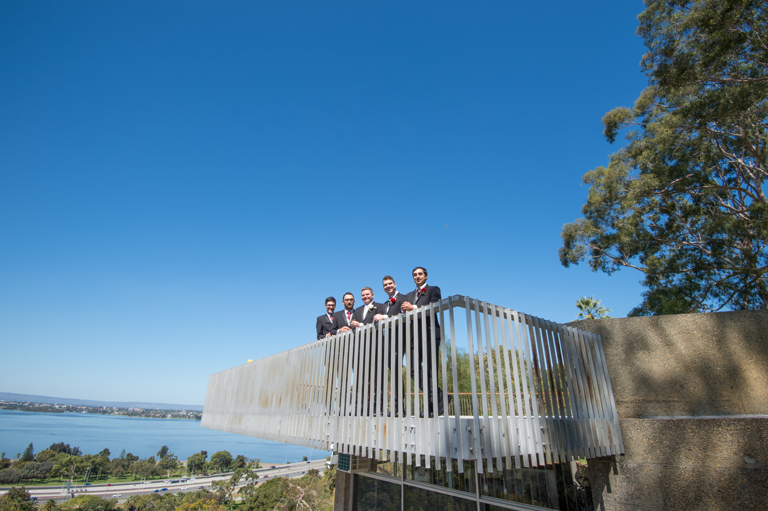 groom with groomsmen at King's Park, intense blue sky