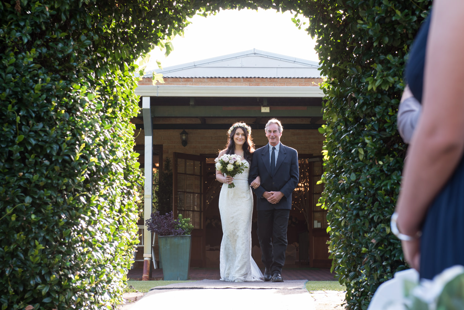 Bride walking dow the aisle at Bridgeleigh reception centre