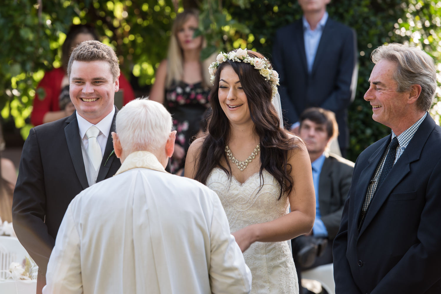 Bride and groom laughing during the ceremony