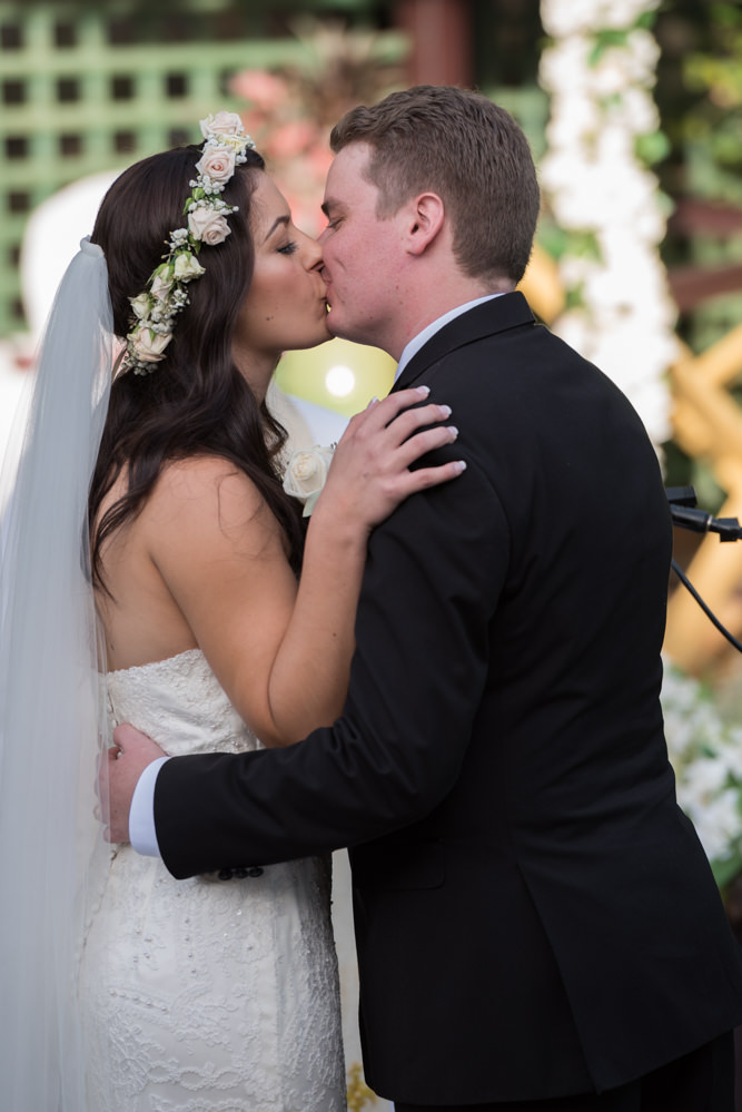 Bride and groom kiss