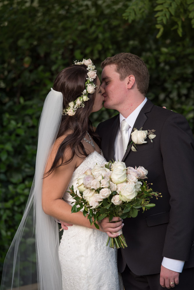 Bride and groom kissing