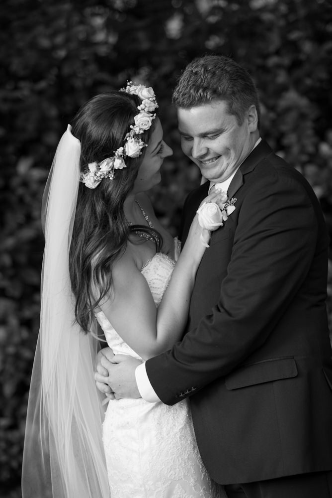 Candid smiles of bride and groom