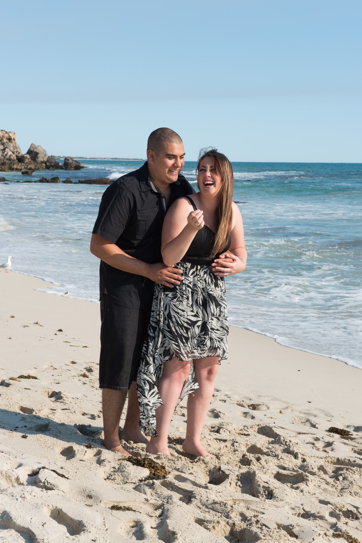 couple laughing on Burns beach