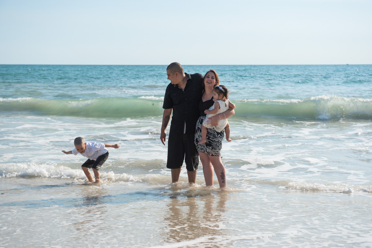 boy fakes surfs in the shallows at Burns beach