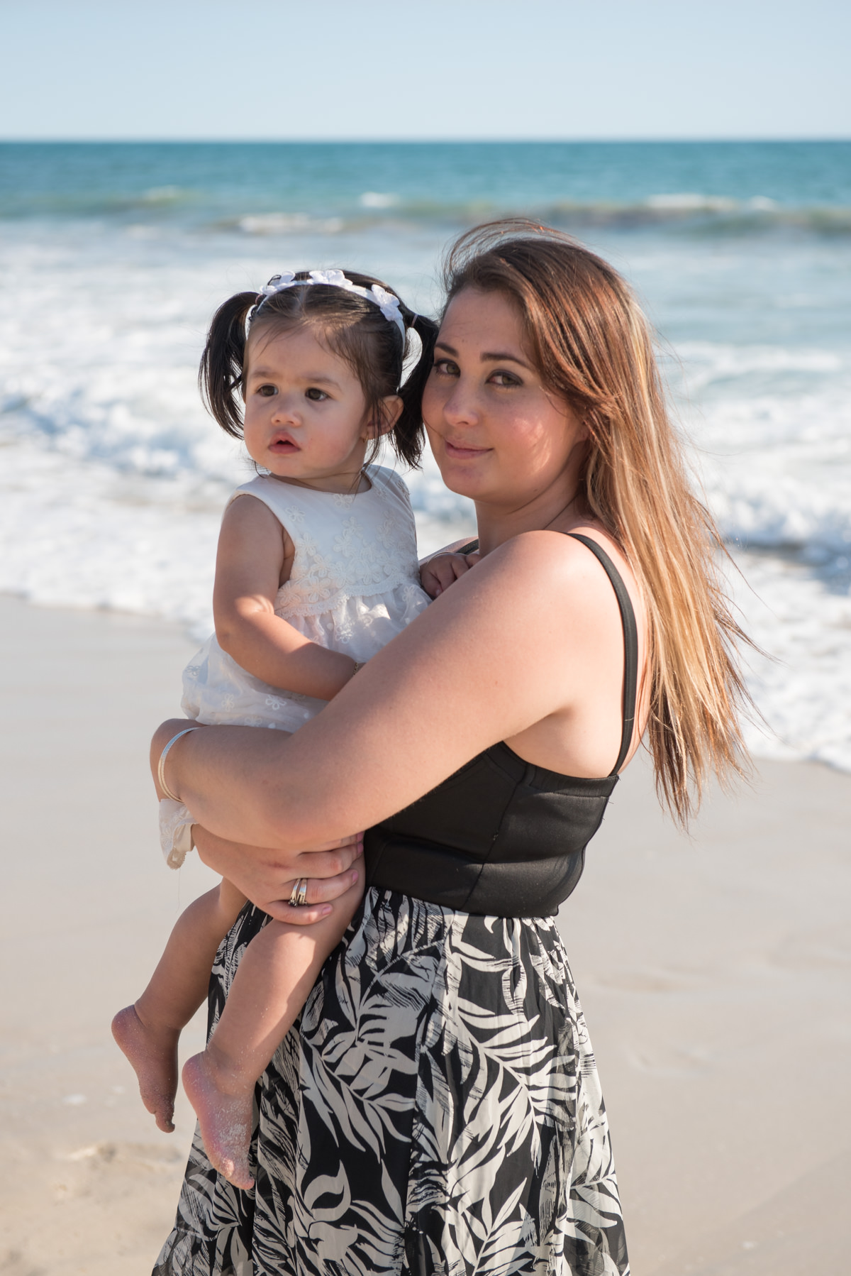 mum and girl on the beach