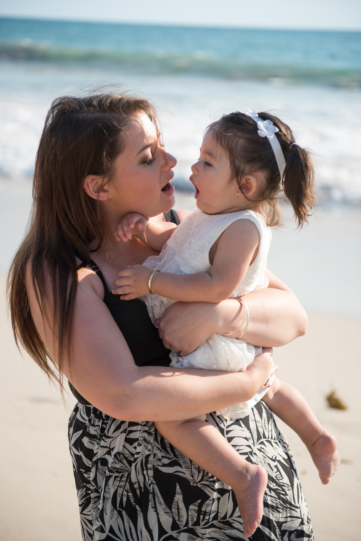 mother and daughter making o faces