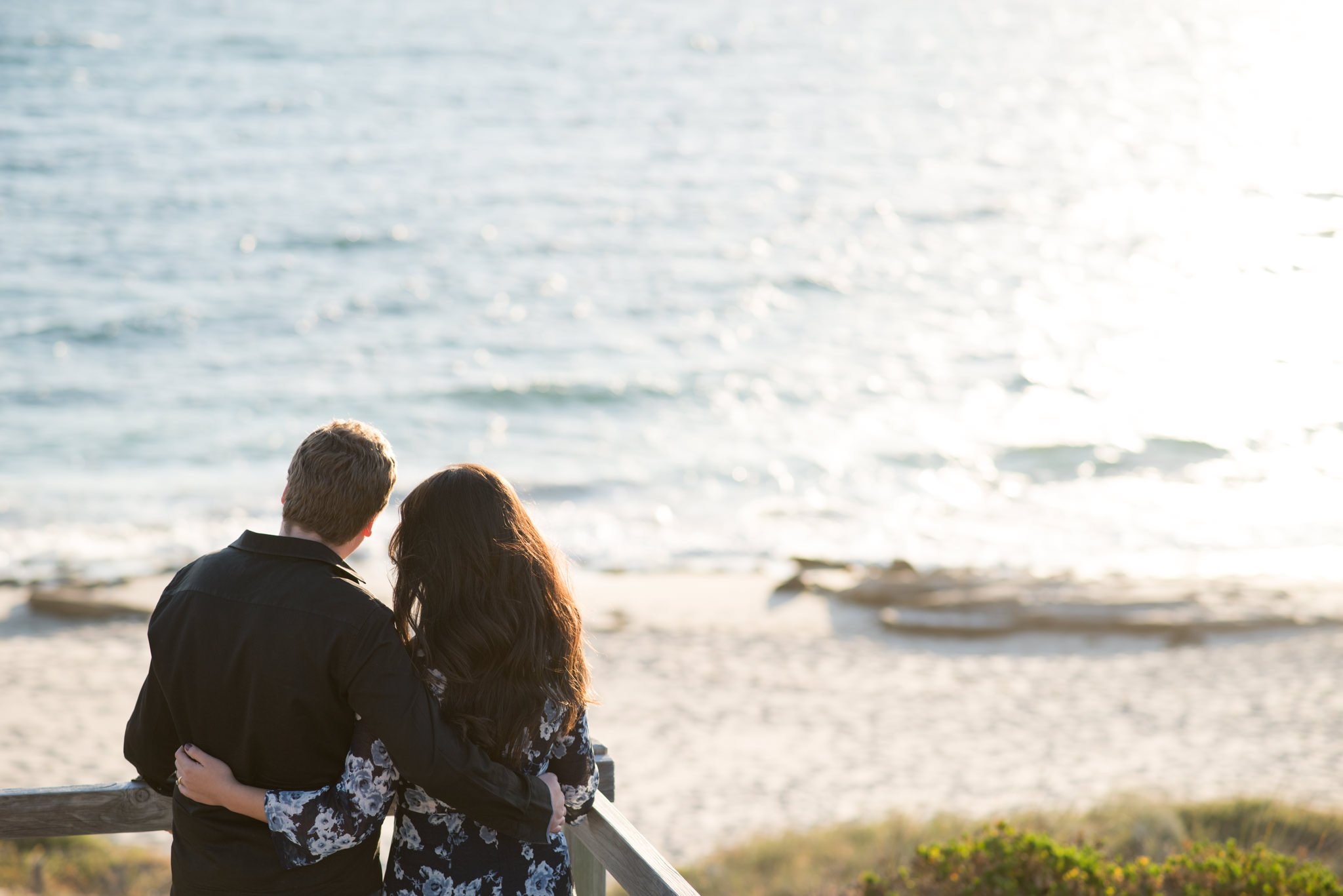 Boy and girl overlooking the sea at burns beach