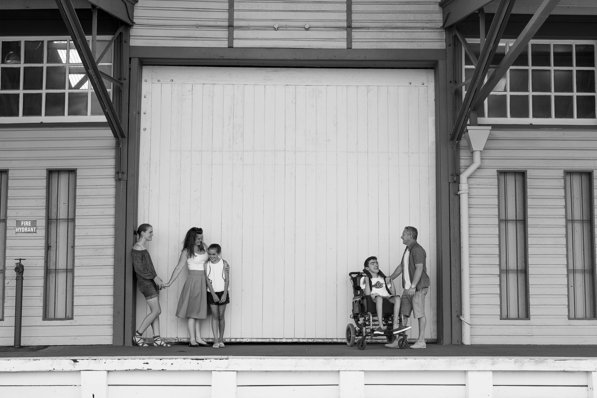 family group shot in front of shed doors at Fremantle