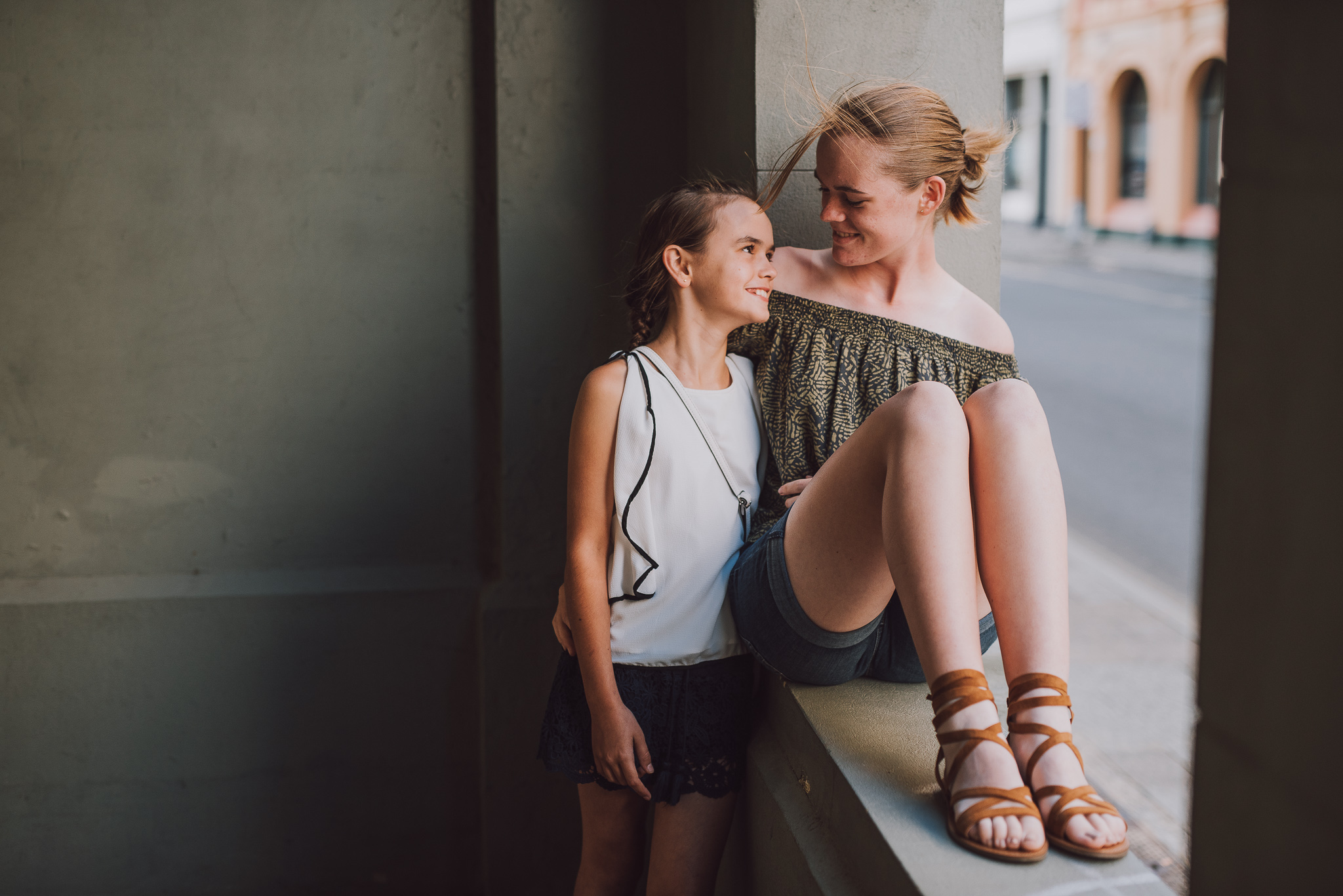 two sisters looking at each other in Fremantle