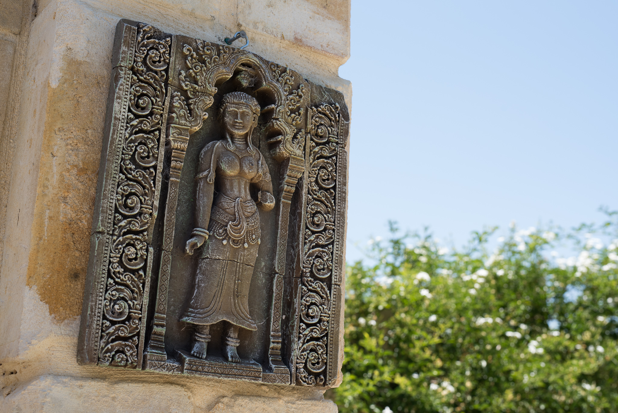 Close up detail of buddhist wall decoration at Serena Metta Retreat