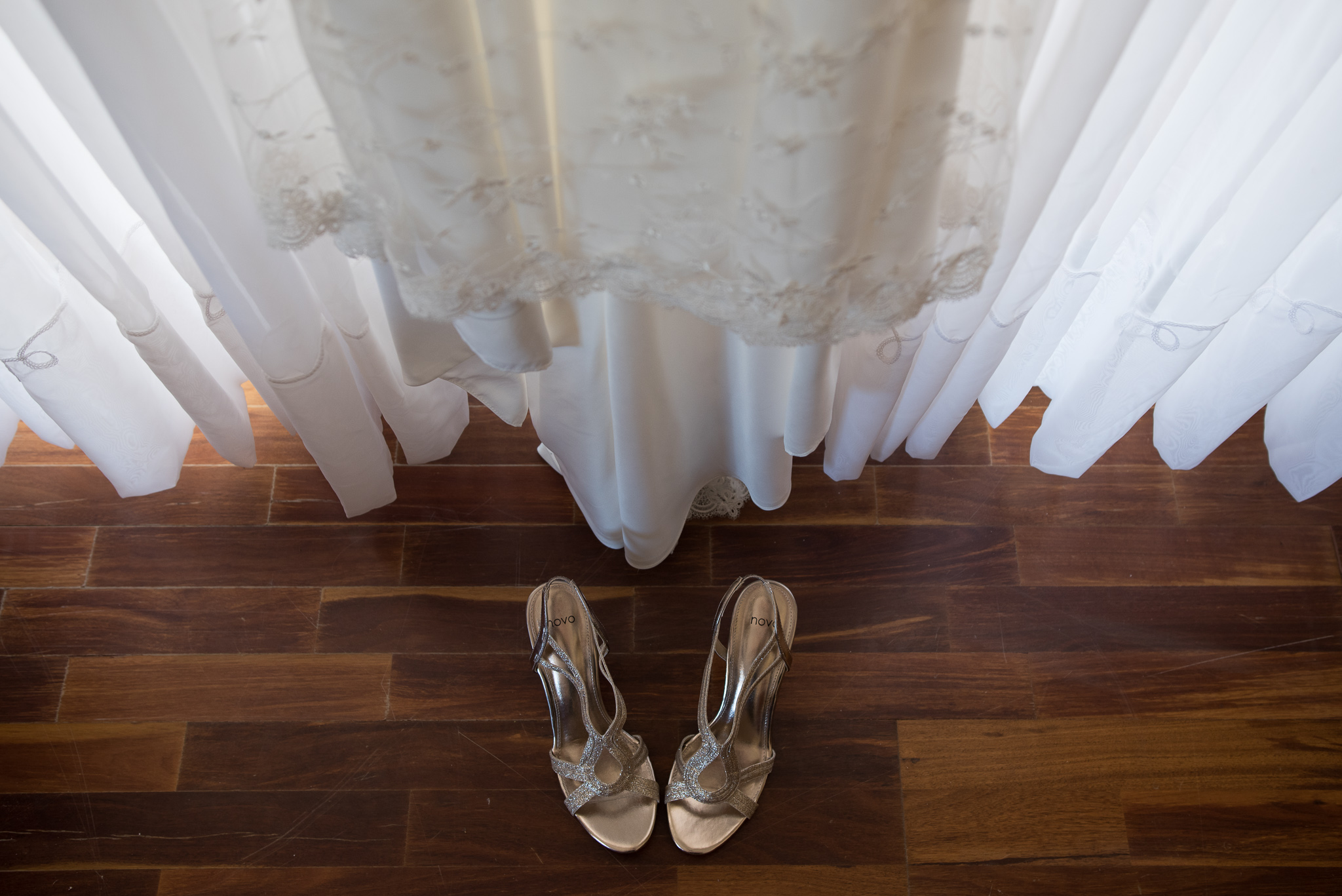 Wedding shoes underneath wedding dress