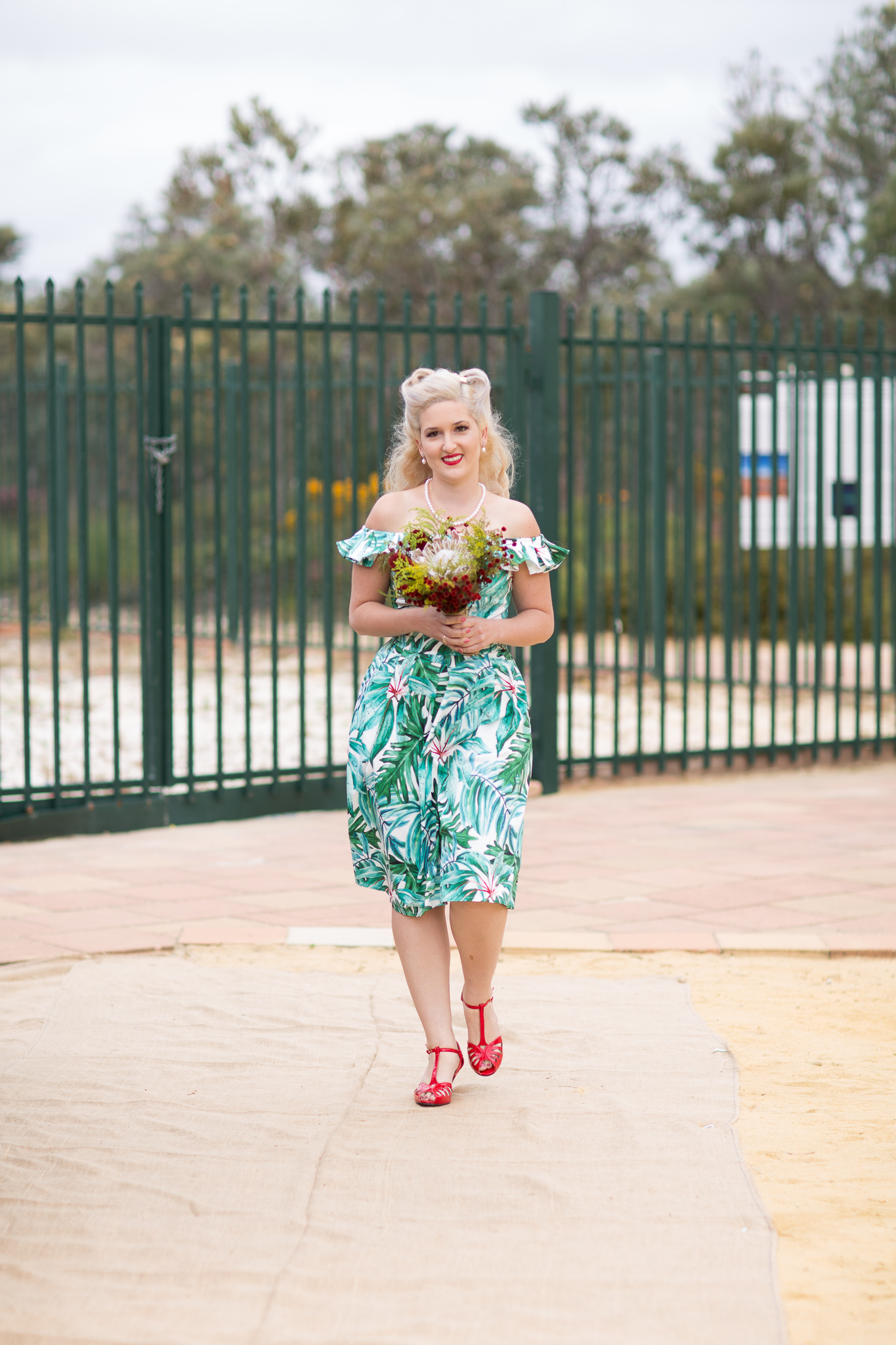 Retro bridesmaid walks down the aisle at the Gravity Discovery Centre