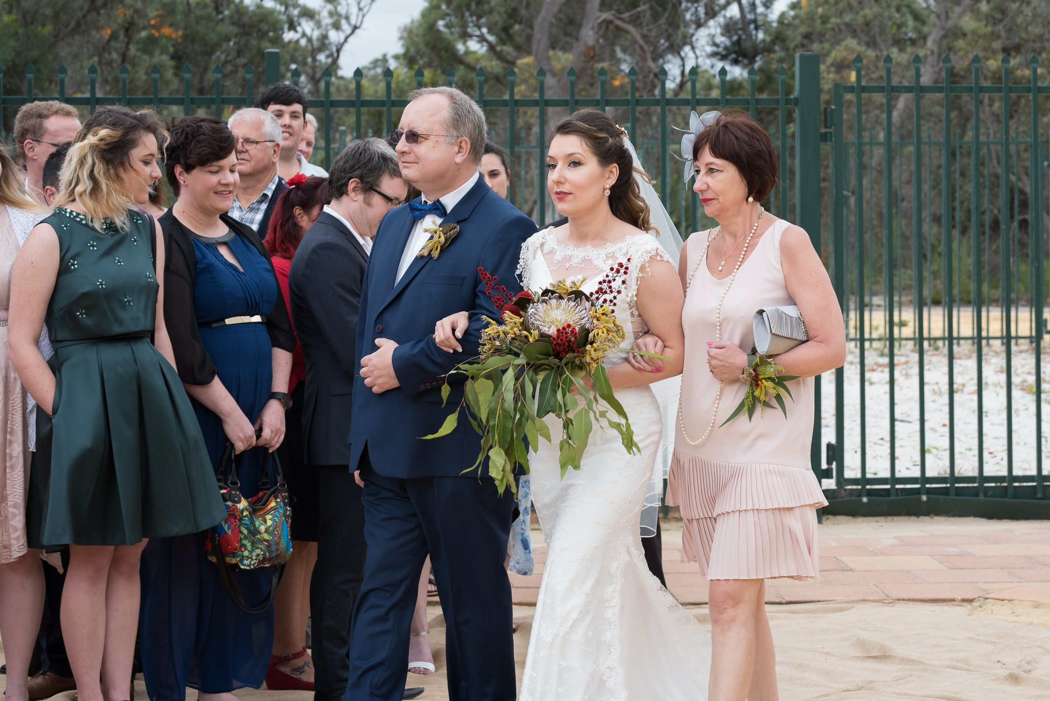 Bride's parents walk her down the aisle at the GDC