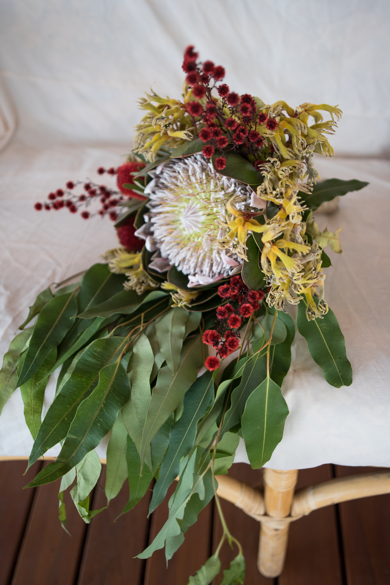 Wedding bouquet of native wildflowers resting on couch