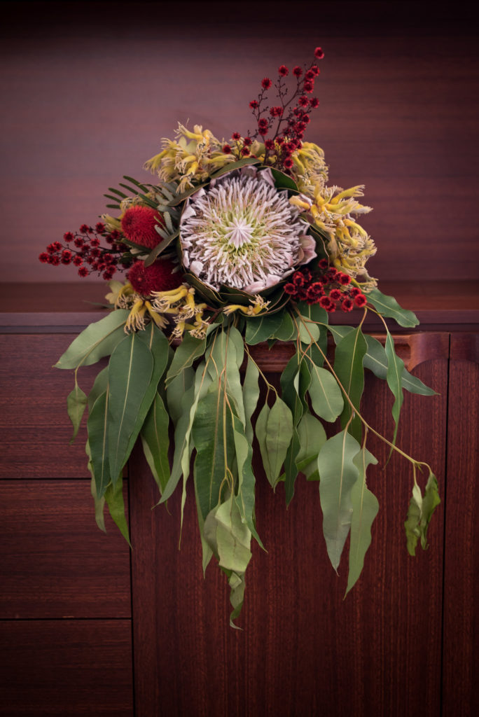 Close up of bridal bouquet of king protea, gumleaves and natives