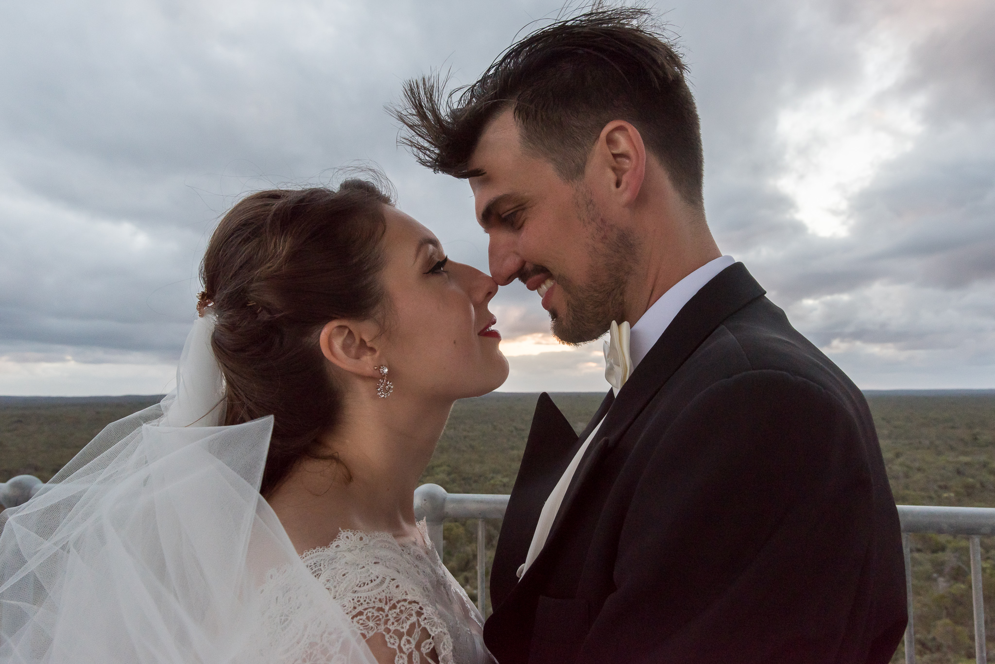 Close up of bride and groom on the top level of the Gravity Tower