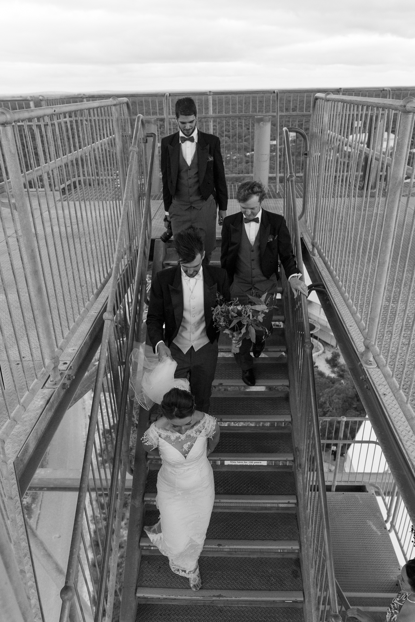 Bridal party walking down the windy leaning gravity tower at the GDC