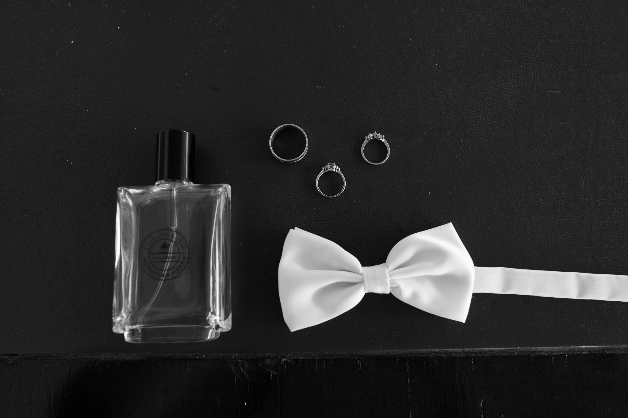 Close up details of wedding rings and bow tie at villa at Serena Metta Retreat