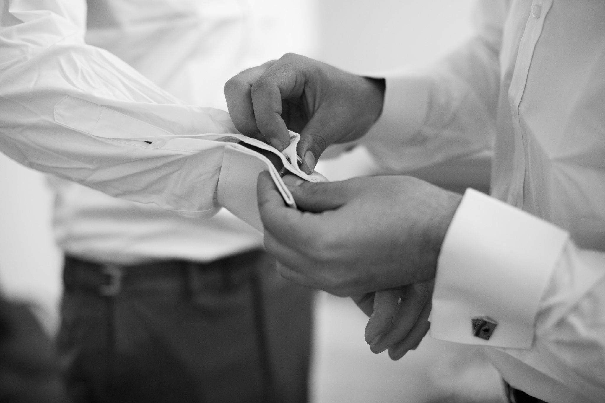 Groom having his cufflinks put on at Serena Metta Retreat