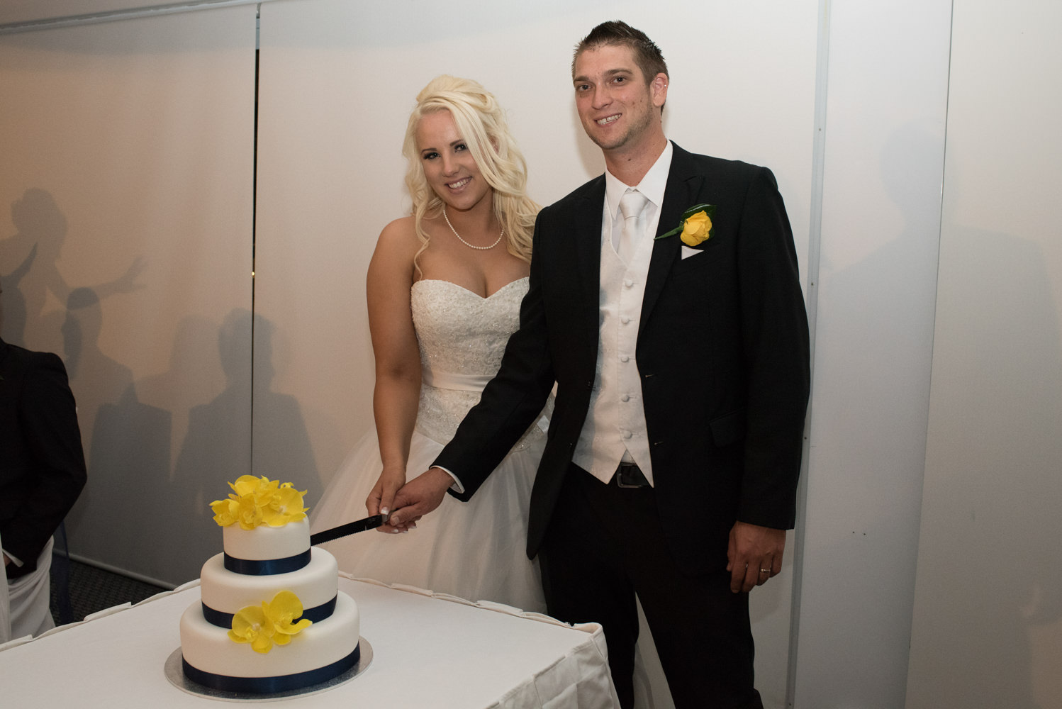 Bride and groom cutting the cake